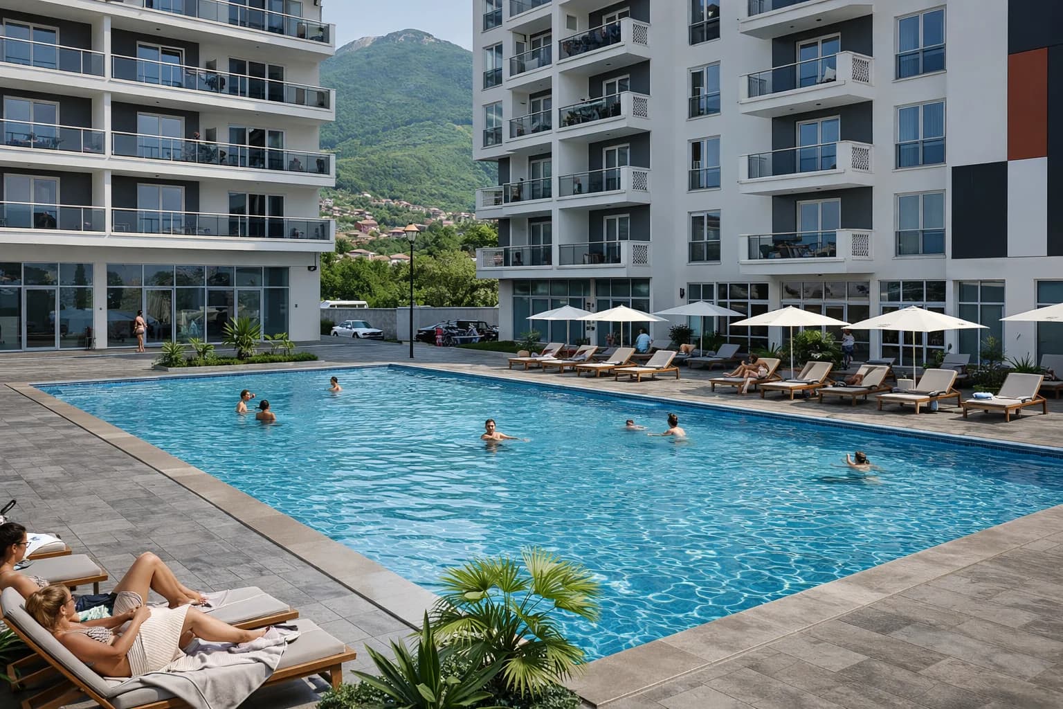 Emerald Residence pool render with sun loungers and residential facades